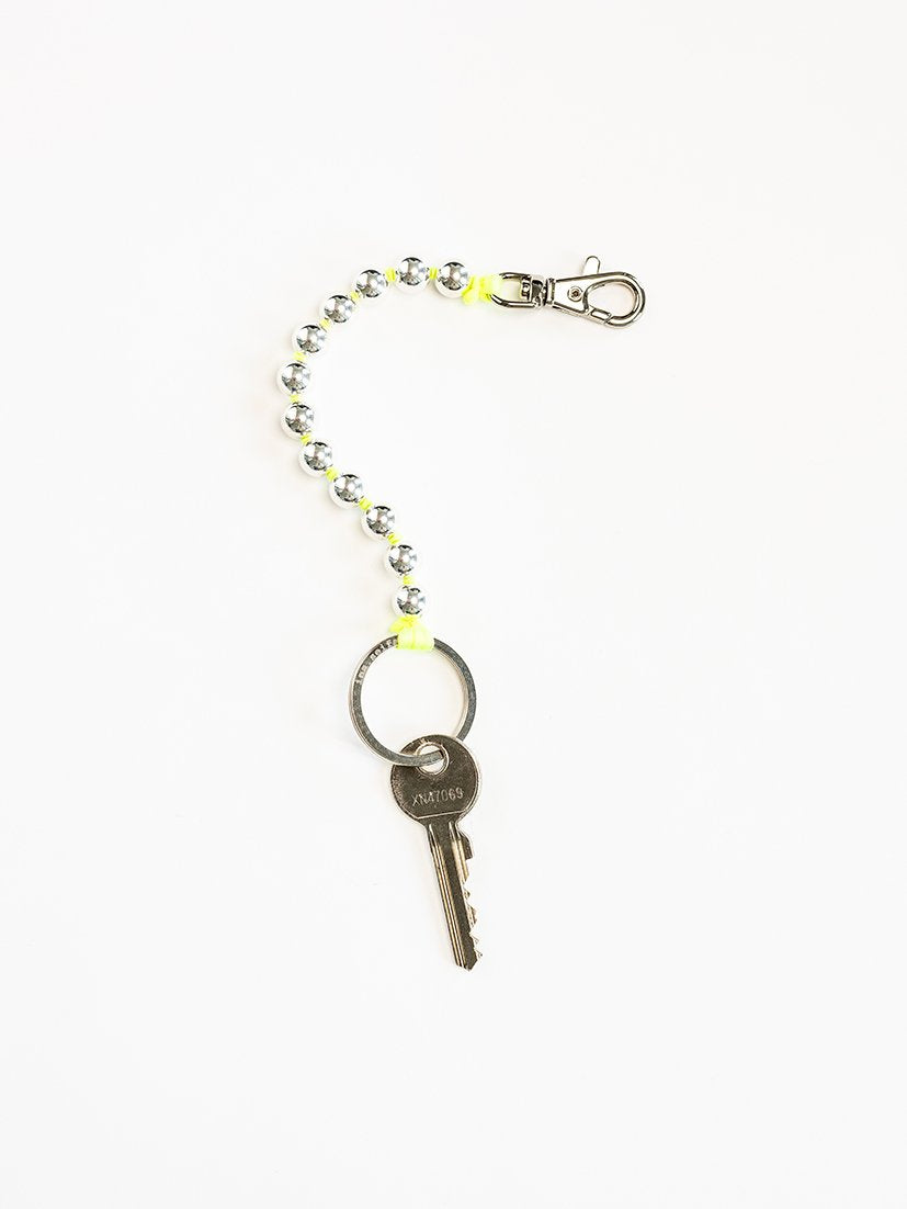 Perlen short, silver - neonyellow